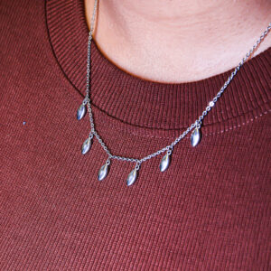 Glimmering bud and silver necklace
